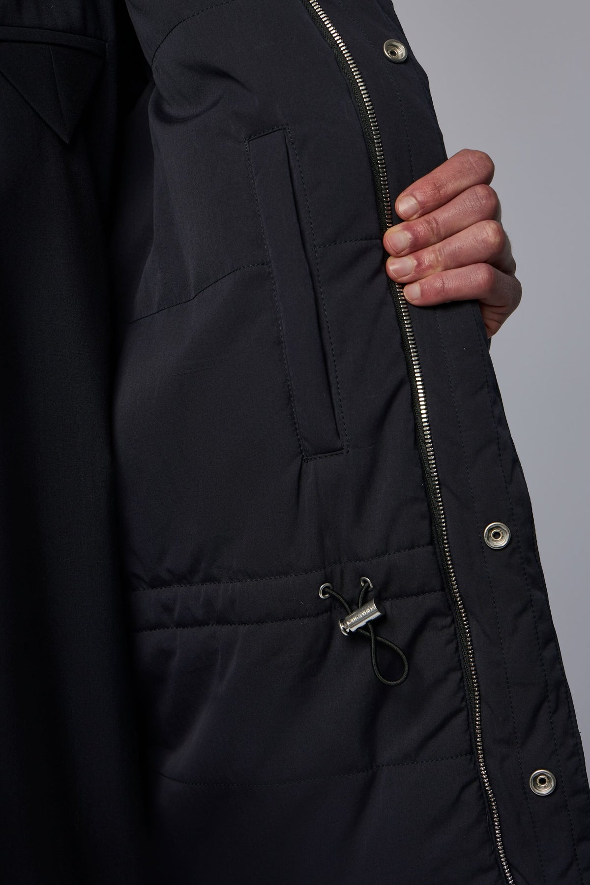 Detail shot of sophisticated dark blue quilted material and craftsmanship