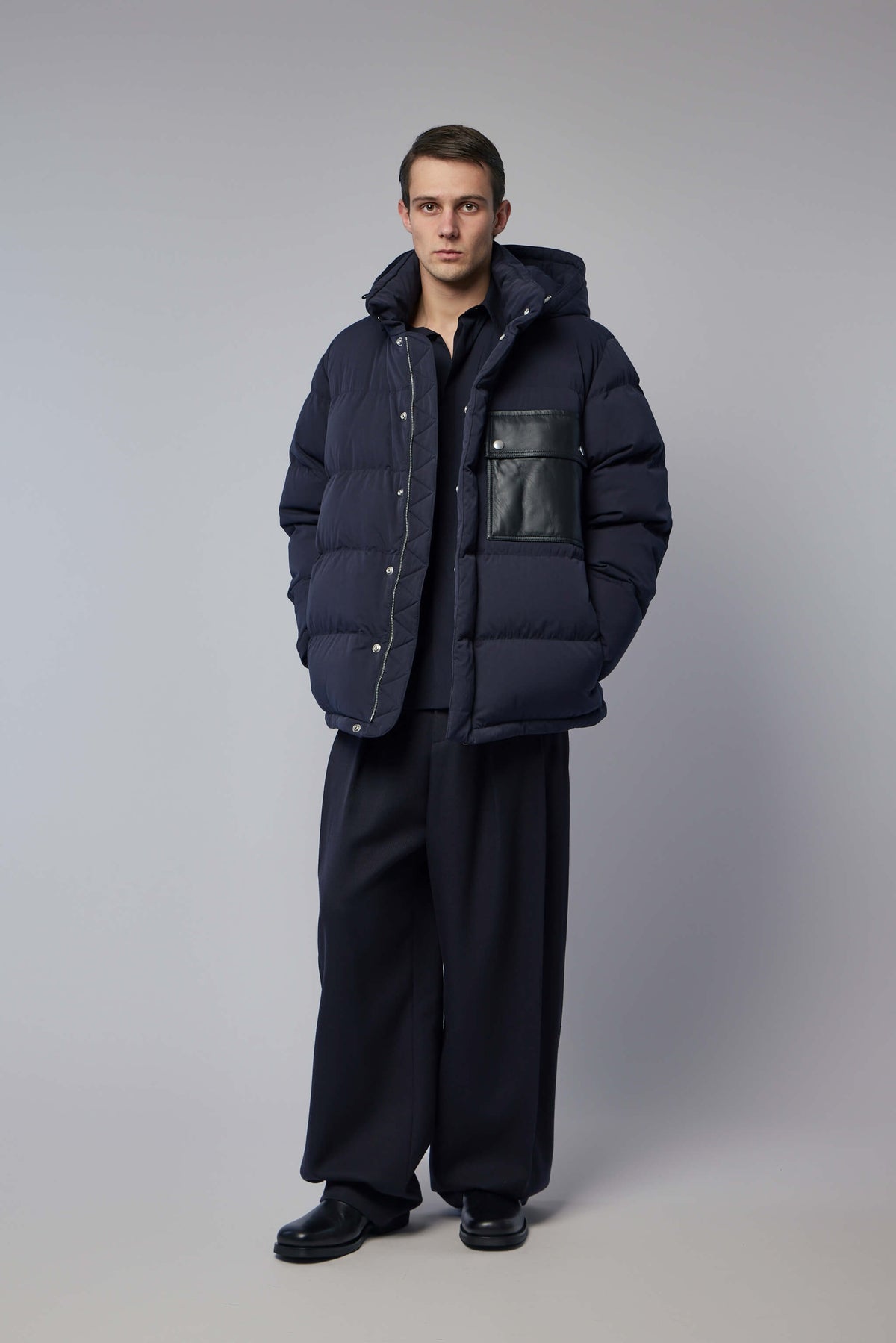 Back view showing quilted pattern and overall silhouette of luxury down jacket