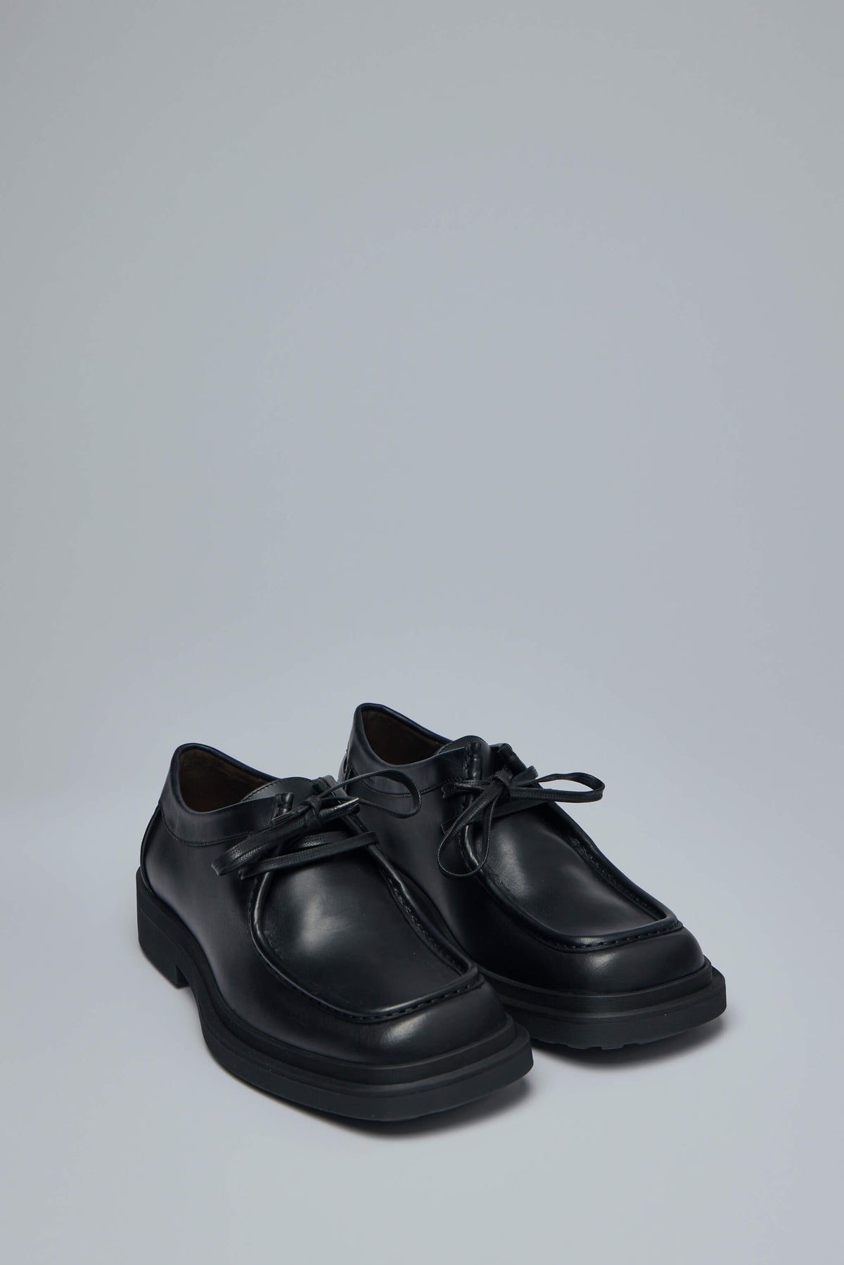 Close-up view of signature woven pattern on Bottega Veneta Ben lace-up shoe