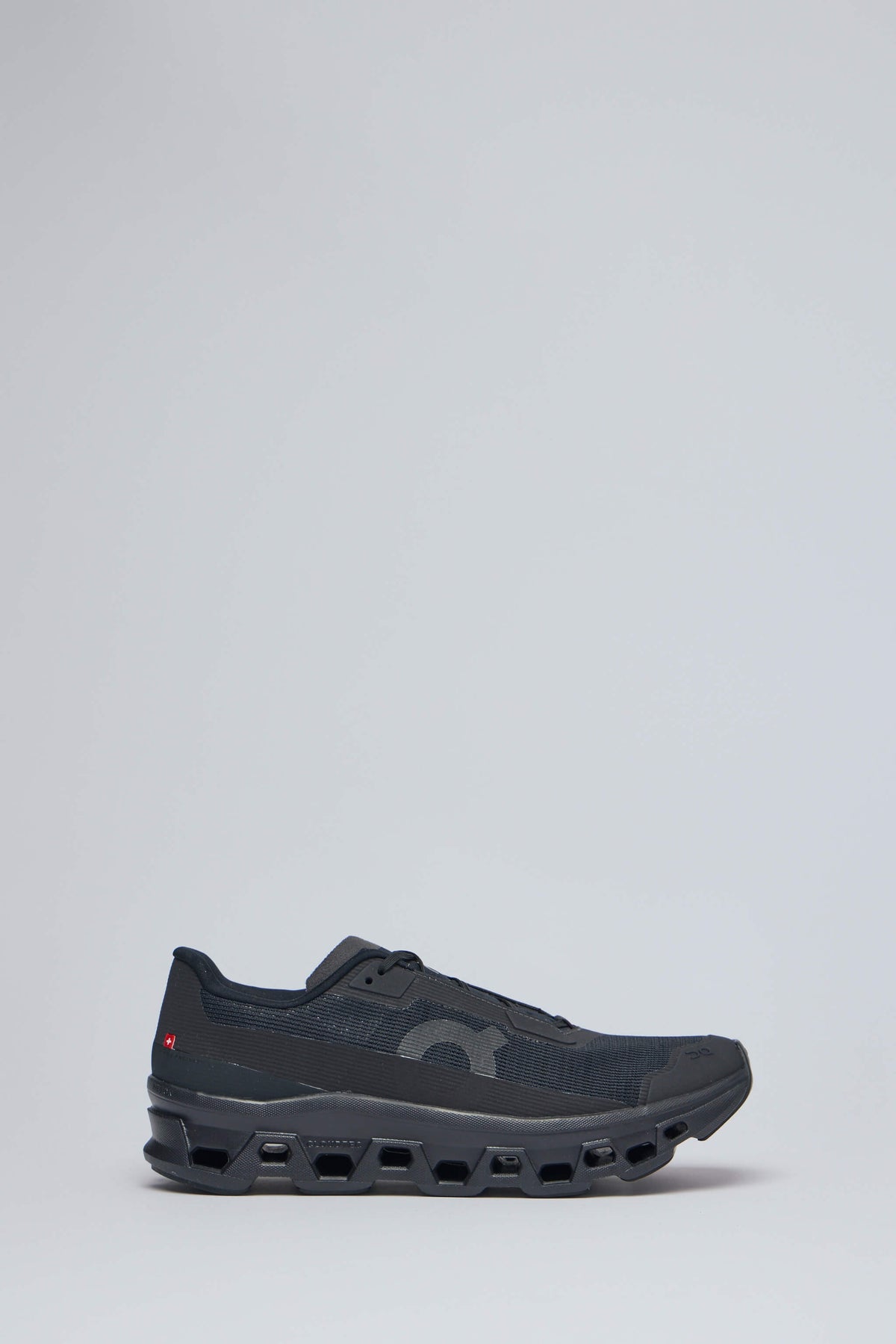 ON Running Low Top Sneakers Cloudmonster Void 1 in black with unique sole pattern