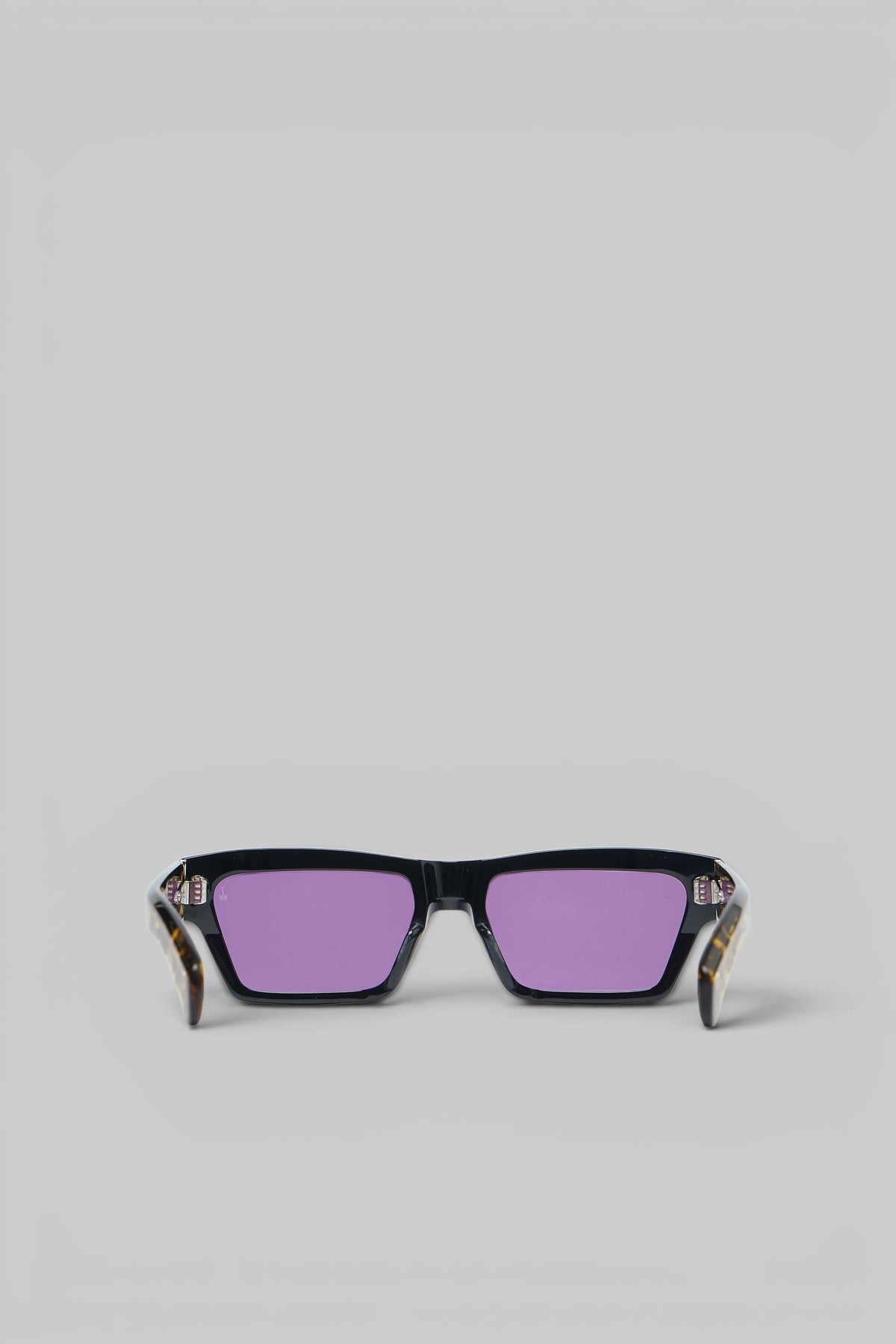 Close-up of metallic hinge accents on Jacques Marie Mage sunglasses