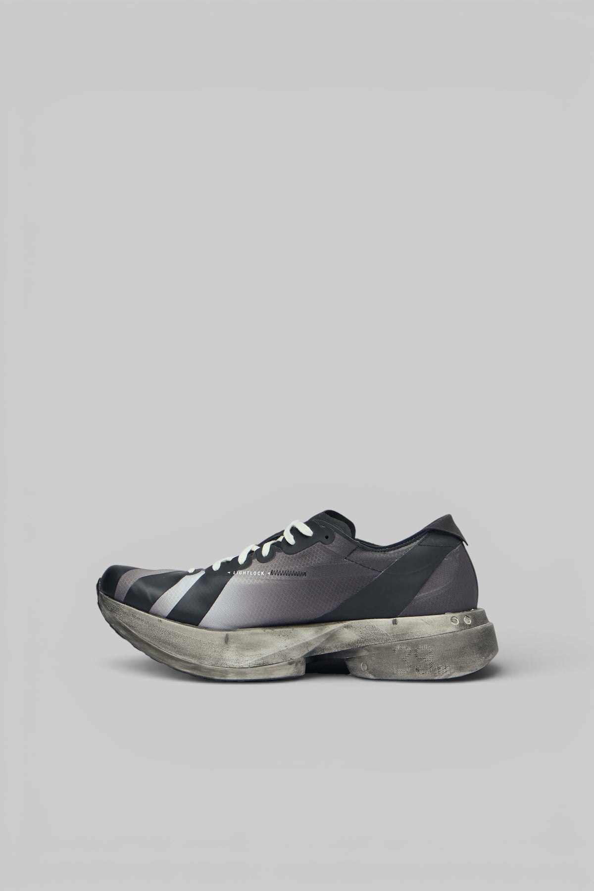 Front view of Y-3 Adios Pro 4 low top sneakers with white laces