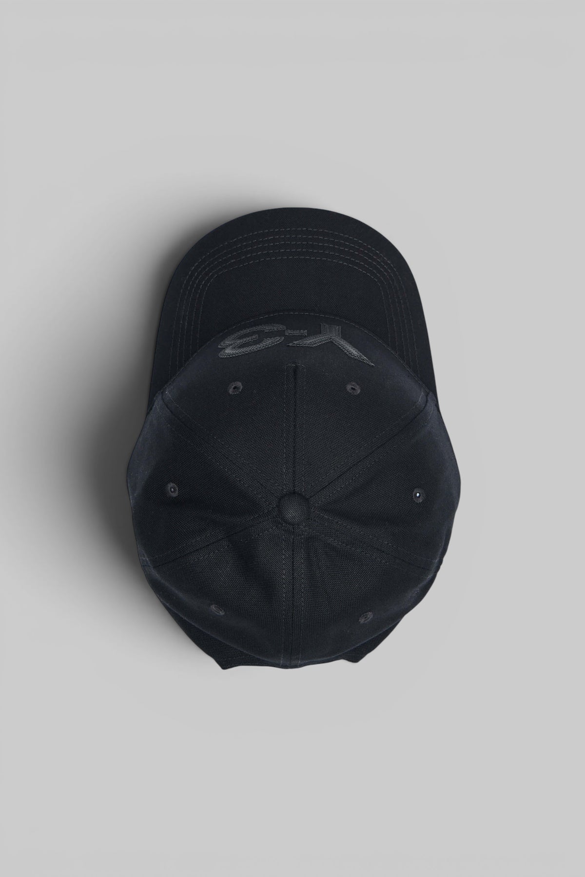 Close-up of embroidered Y-3 logo on cotton cap front