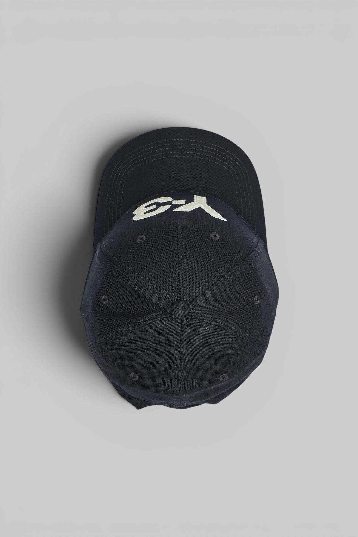 Close-up of Y-3 oversized logo embroidery detail on cap
