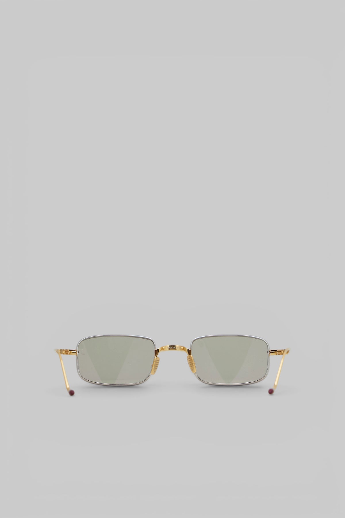 Close-up of thin metallic frame on Jacques Marie Mage Dusk sunglasses