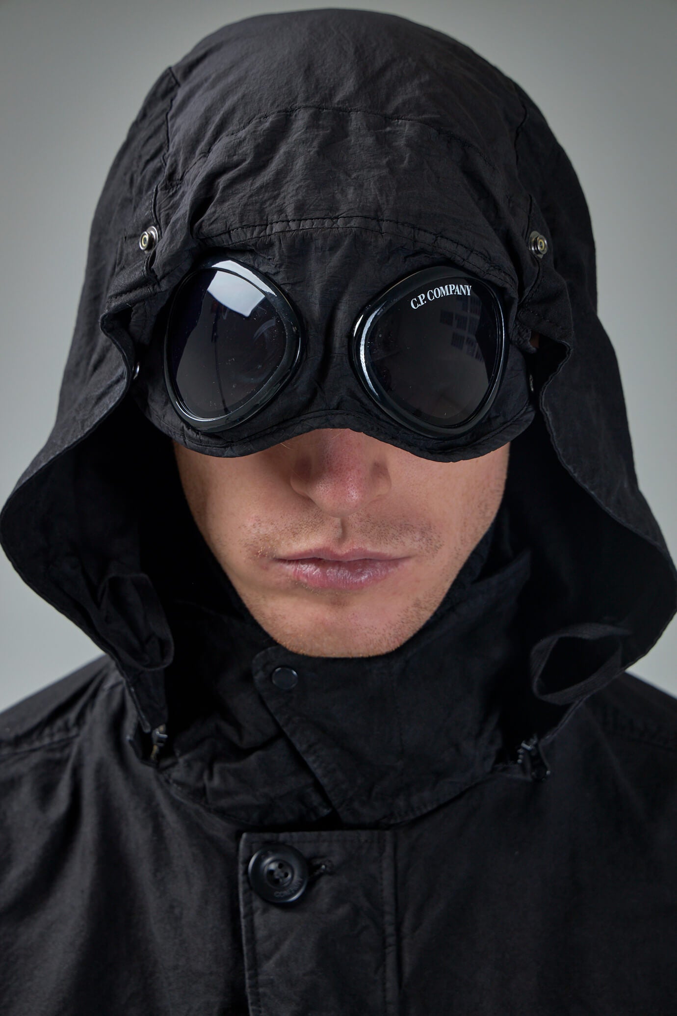 Jacket with cheap goggles in hood