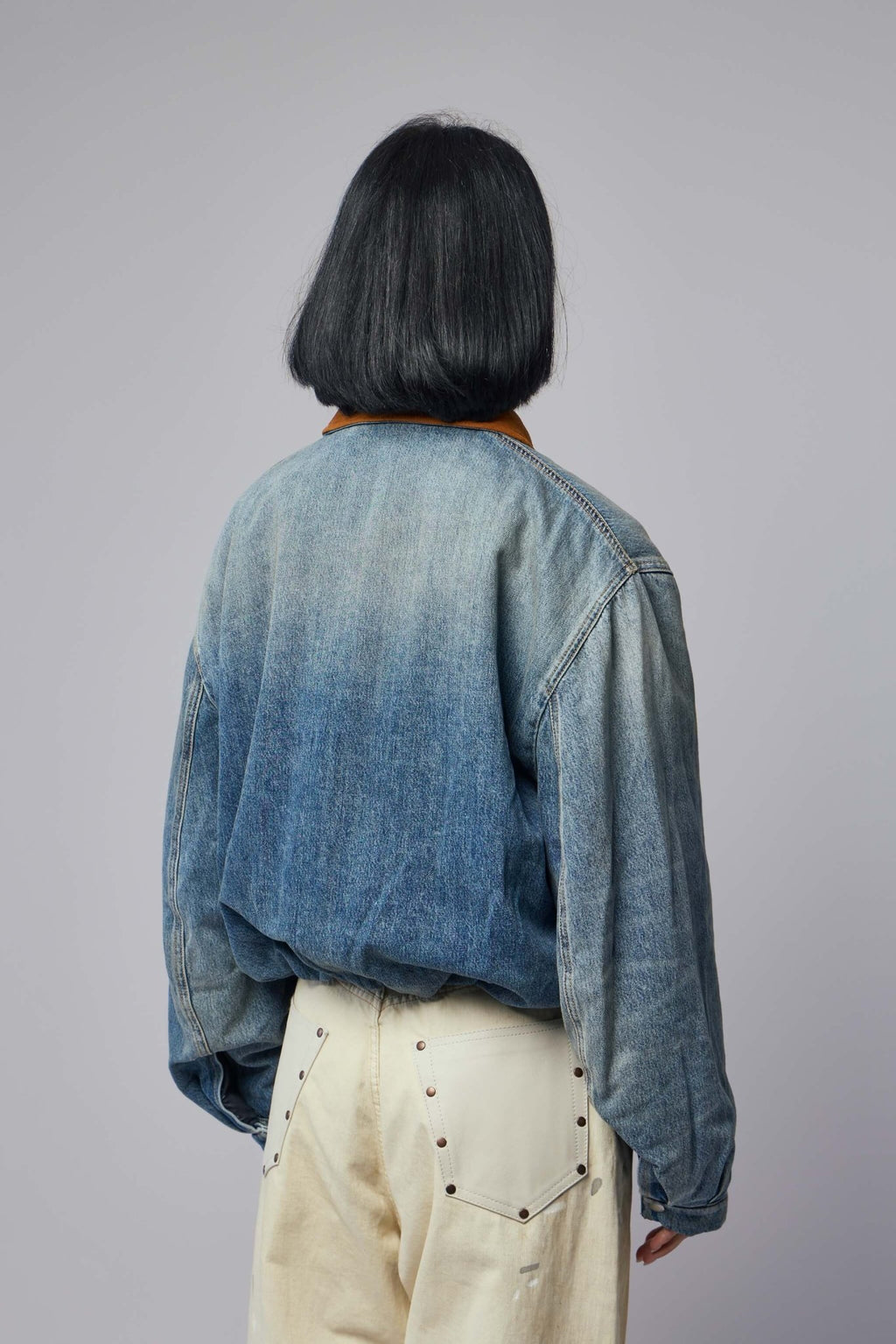 Acne Studios - Denim Button‑up Shirt - LABELS - Detail shot of brown leather collar on denim-textured bomber jacket