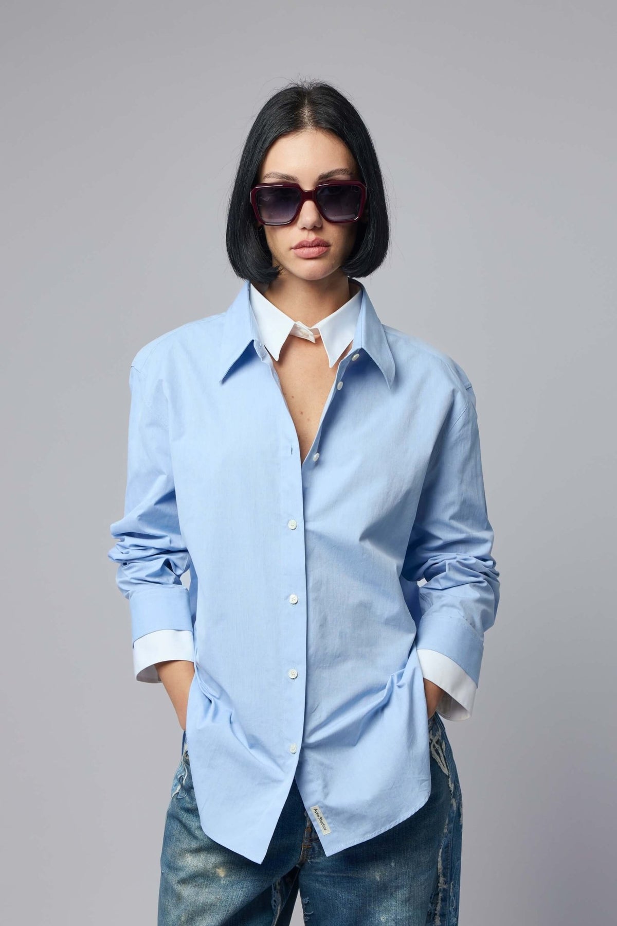 Acne Studios layered button-up blouse in light blue cotton with pointed collar