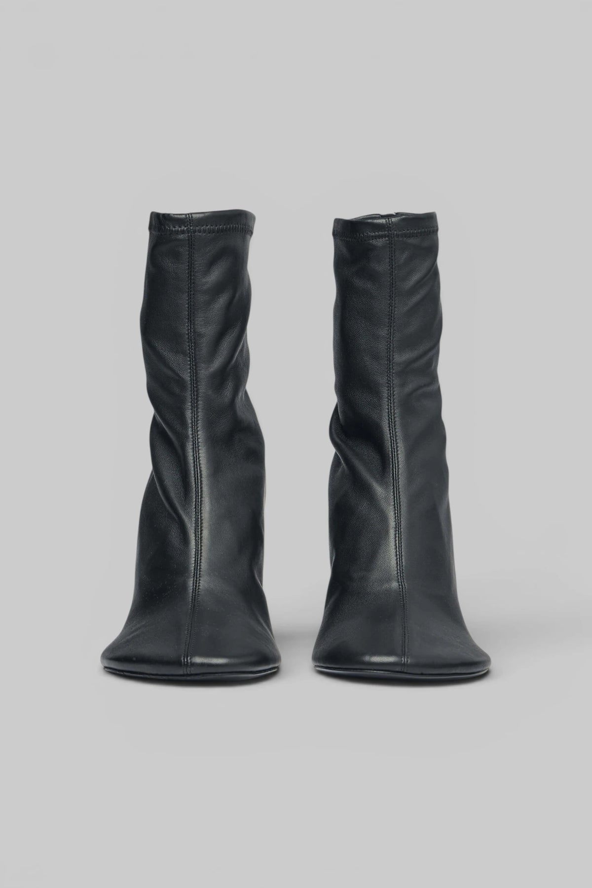 Side view of Acne Studios leather ankle boot with zipper