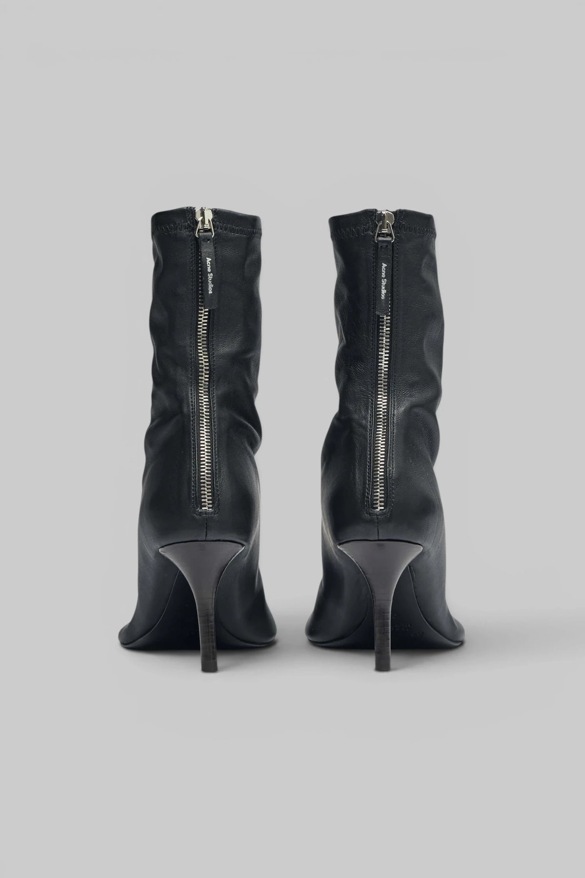 Acne Studios ankle boots styled with tailored trousers