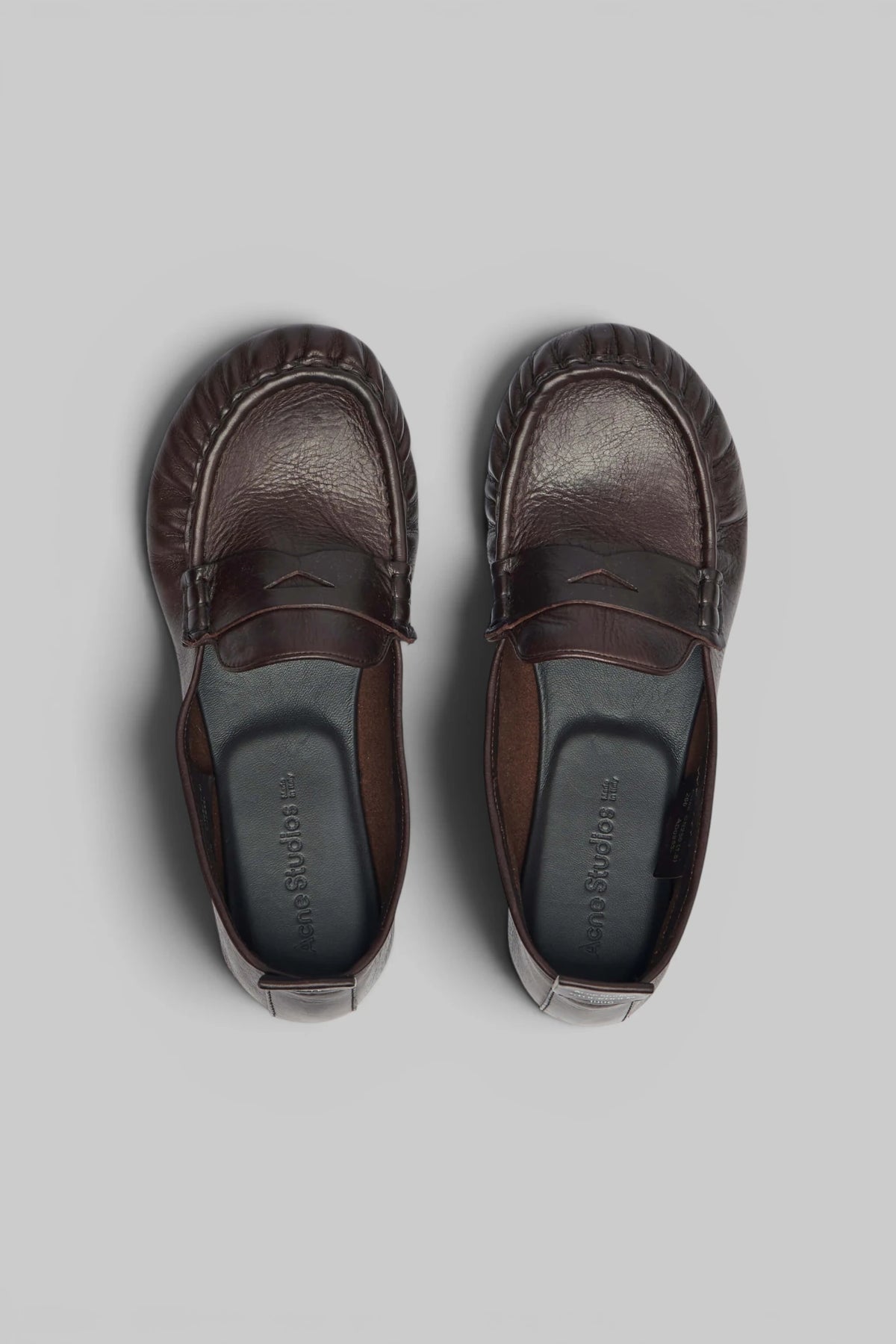 Close-up of stitching detail on Acne Studios leather flats