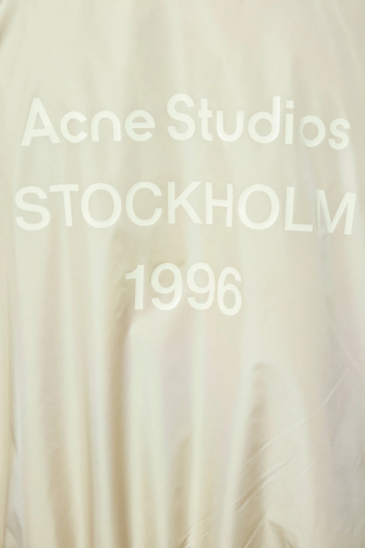 Model wearing Acne Studios Lightweight Nylon Jacket with jeans, view 7