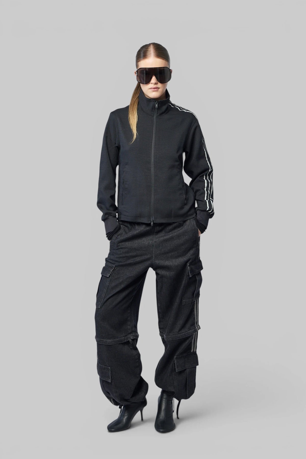Front view of Adidas Originals Cargo Pants showing flap pockets