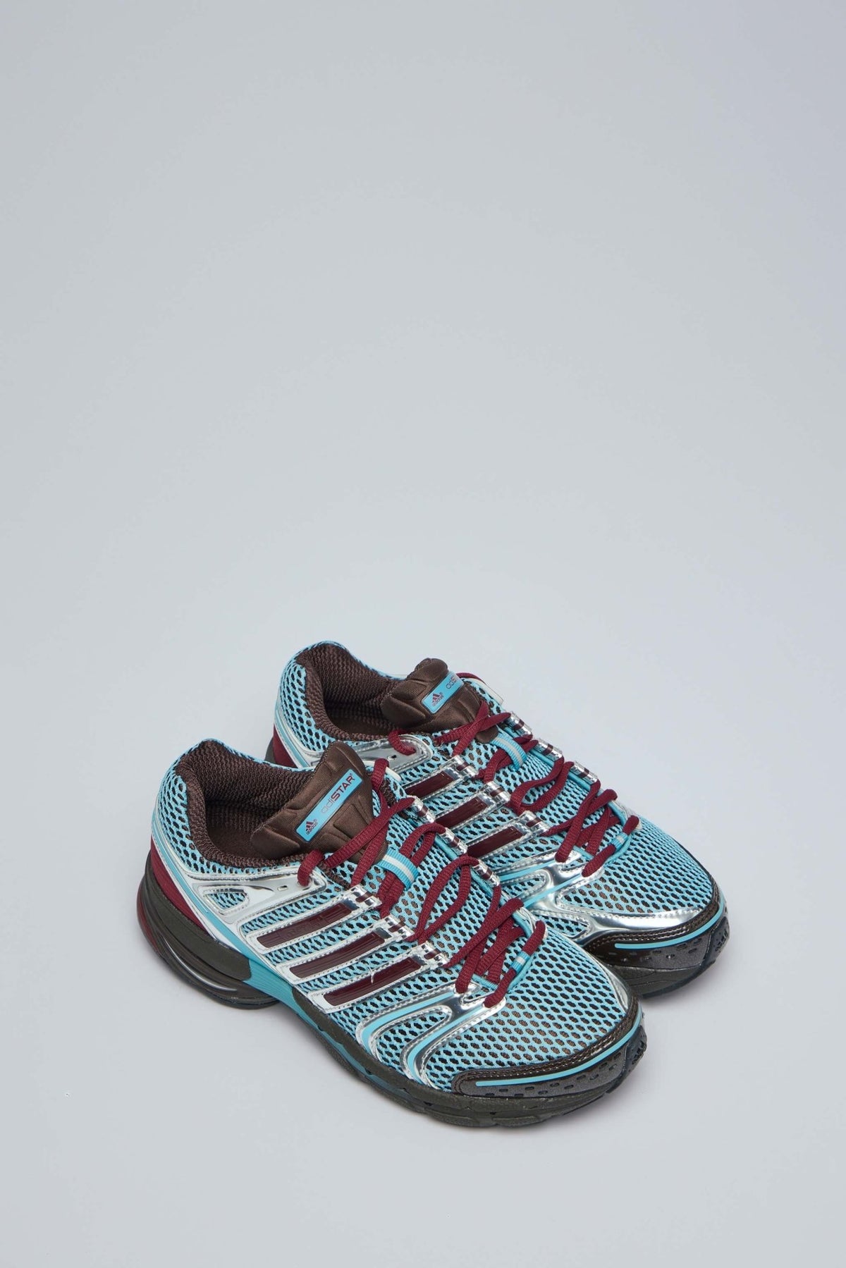 Side view of Adidas Control 5 W sneakers showing mesh upper and lace-up design