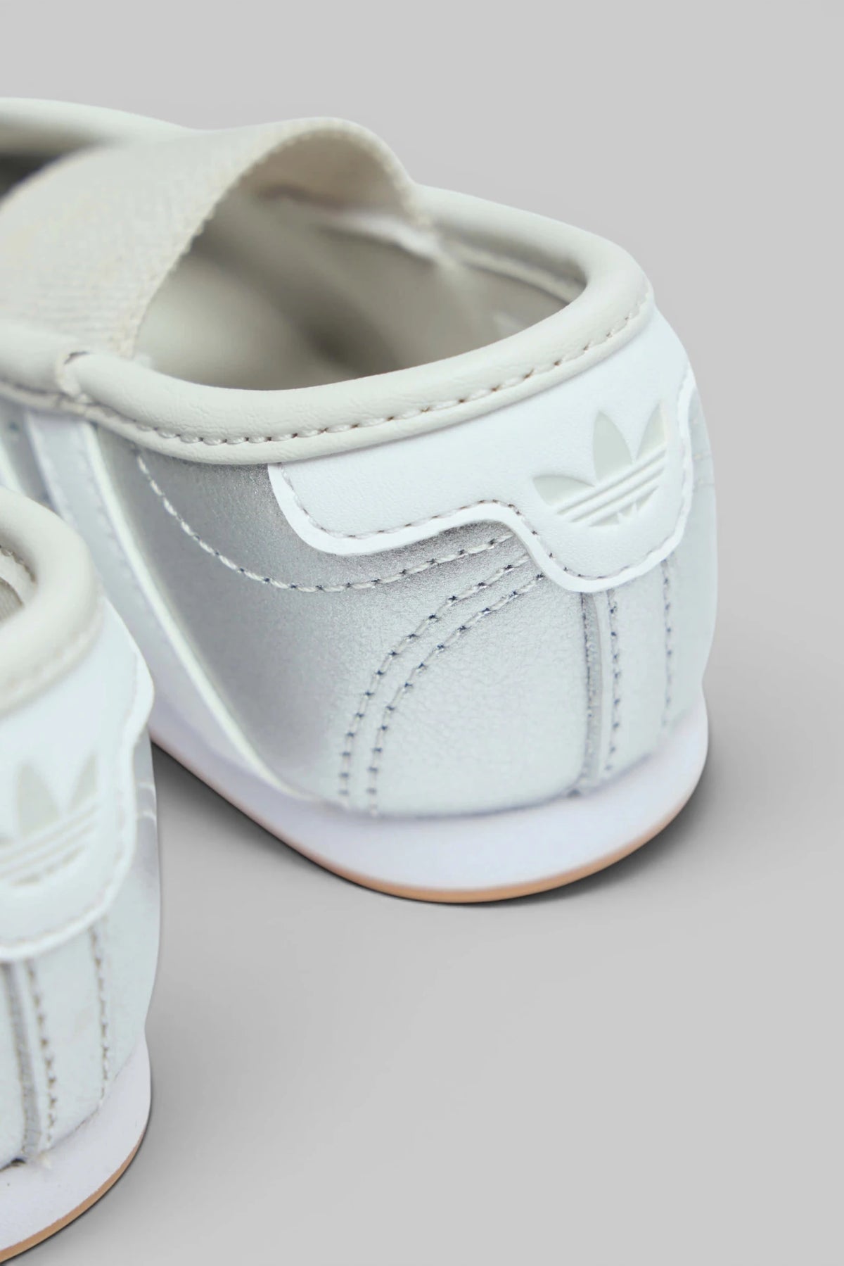 Full pair of Adidas Originals Flats on display