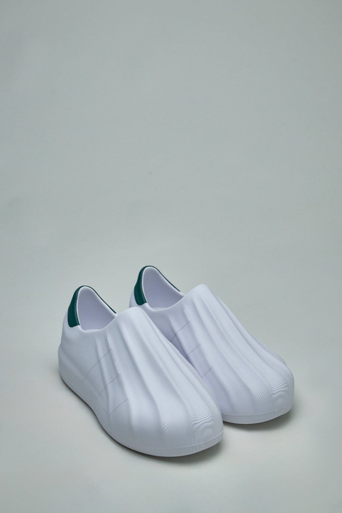 Side view of AdiFOM Superstar showing iconic three stripes logo detail