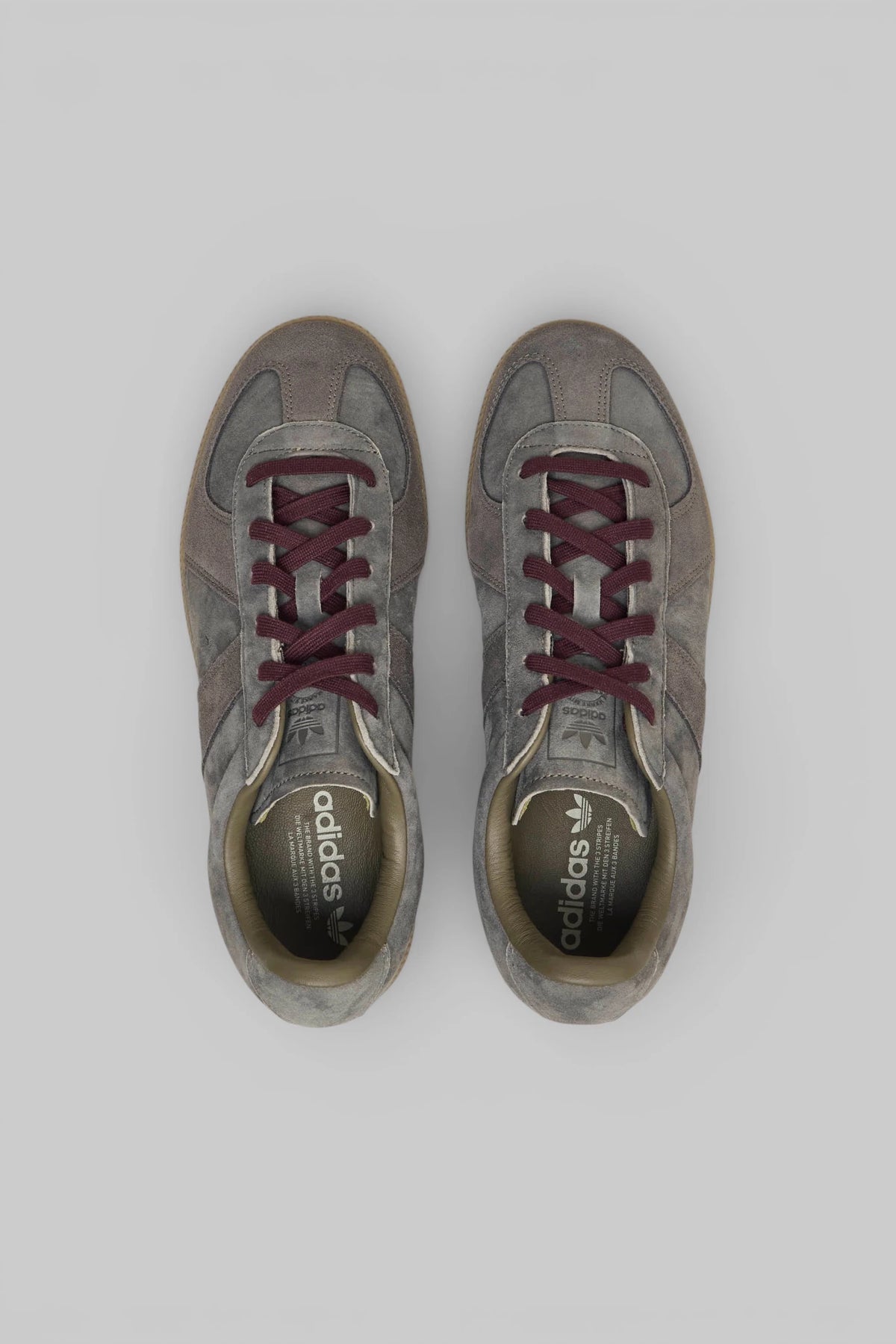 Close-up of contrasting burgundy laces on Adidas Originals BW Army sneakers