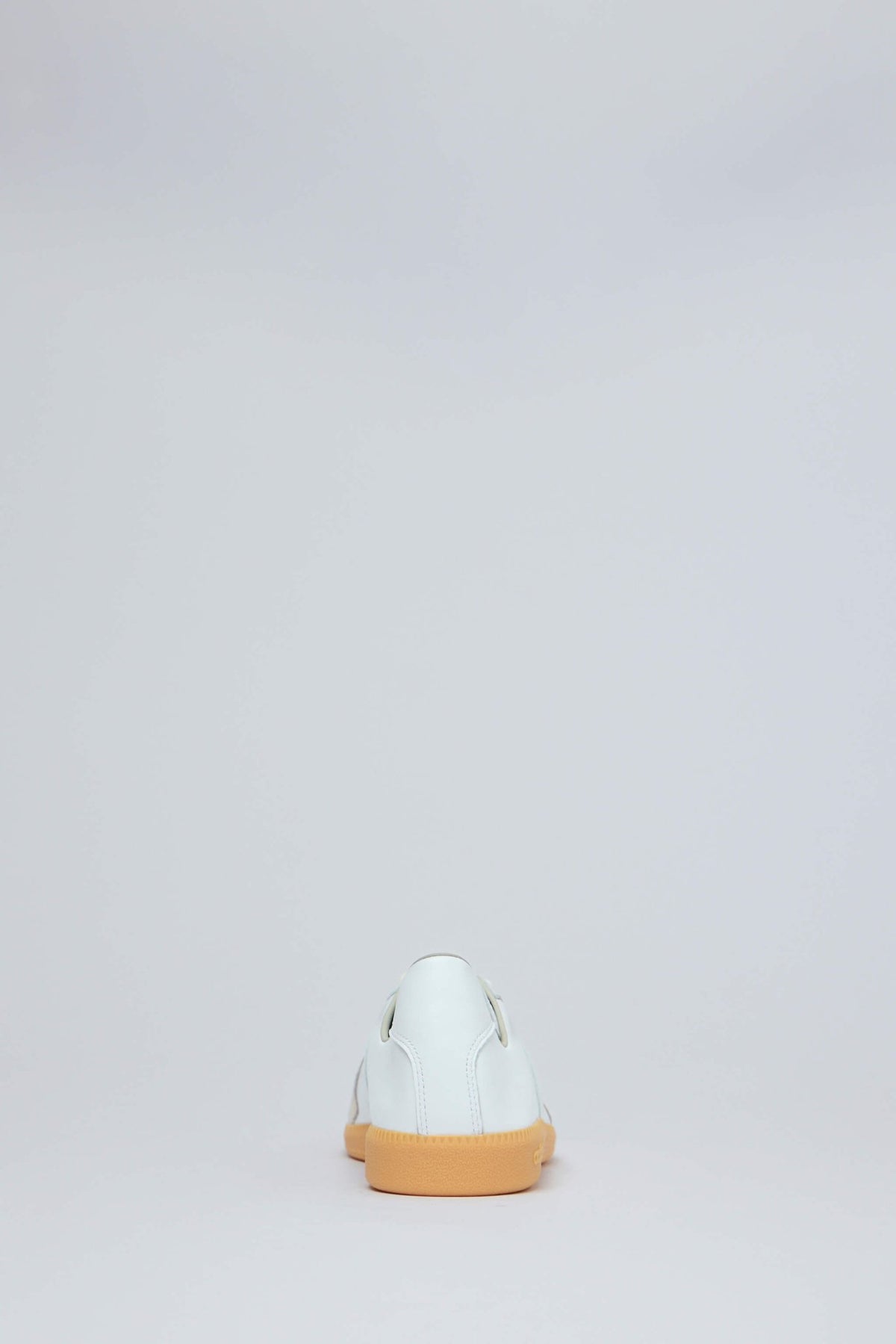 Back view highlighting contrast gum outsole and heel design
