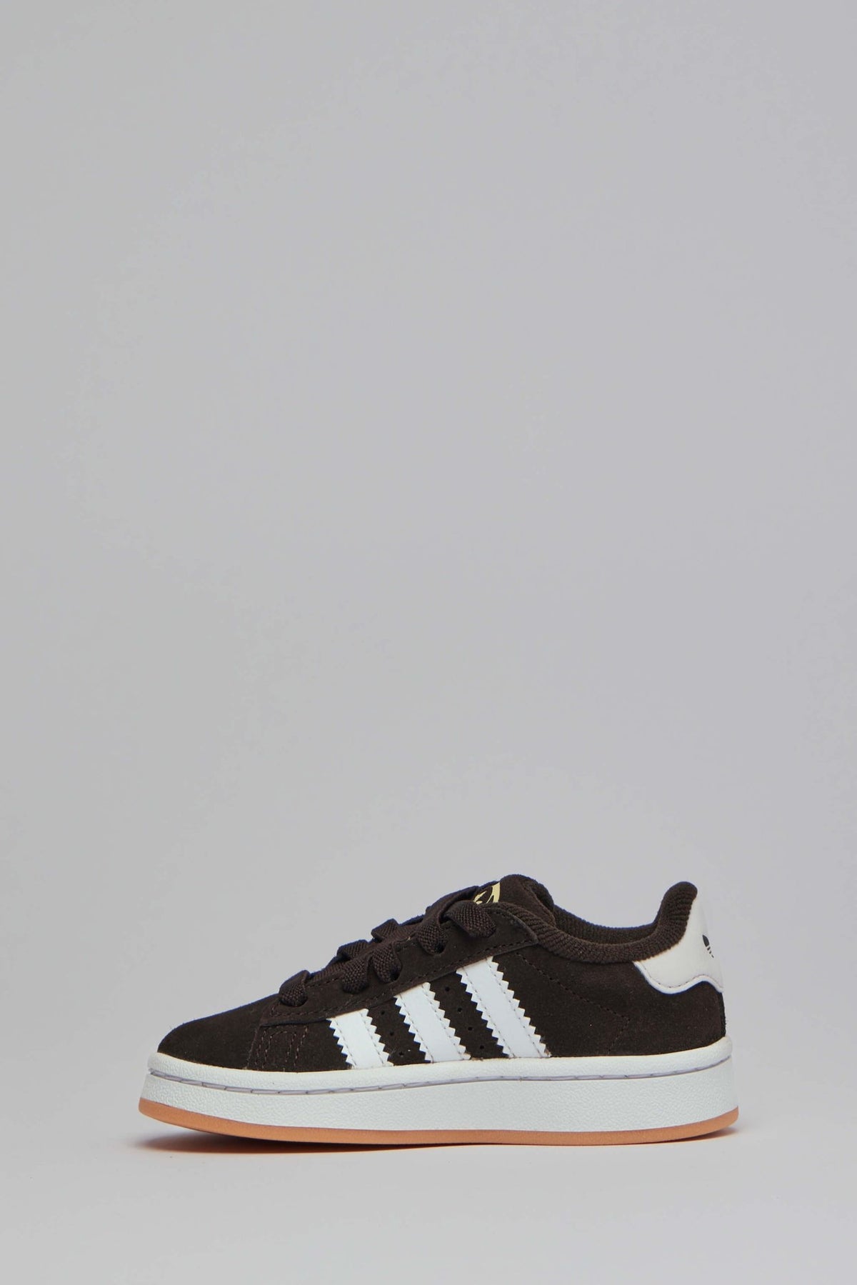 Close-up of brown suede upper and white rubber midsole detail