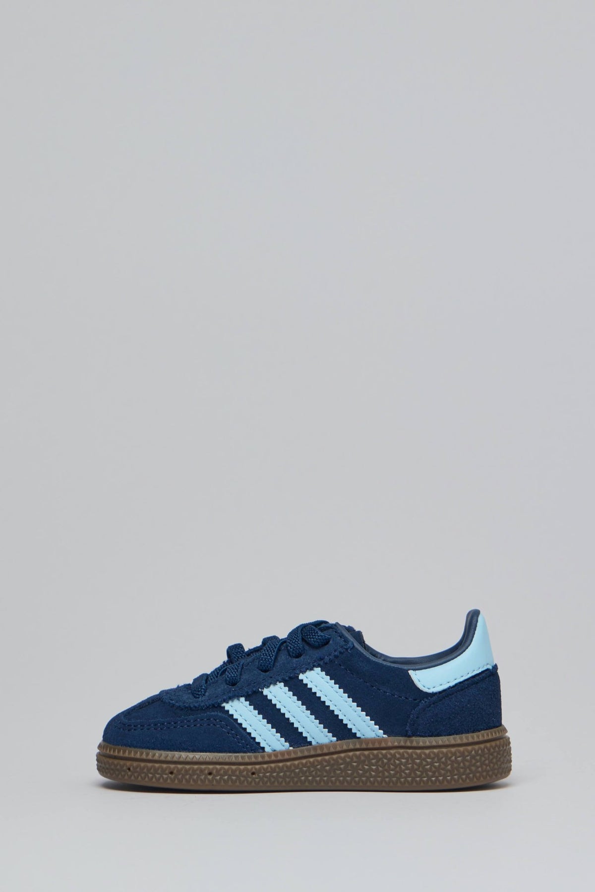 Close-up of gold Adidas branding detail on Handball Spezial CF sneakers