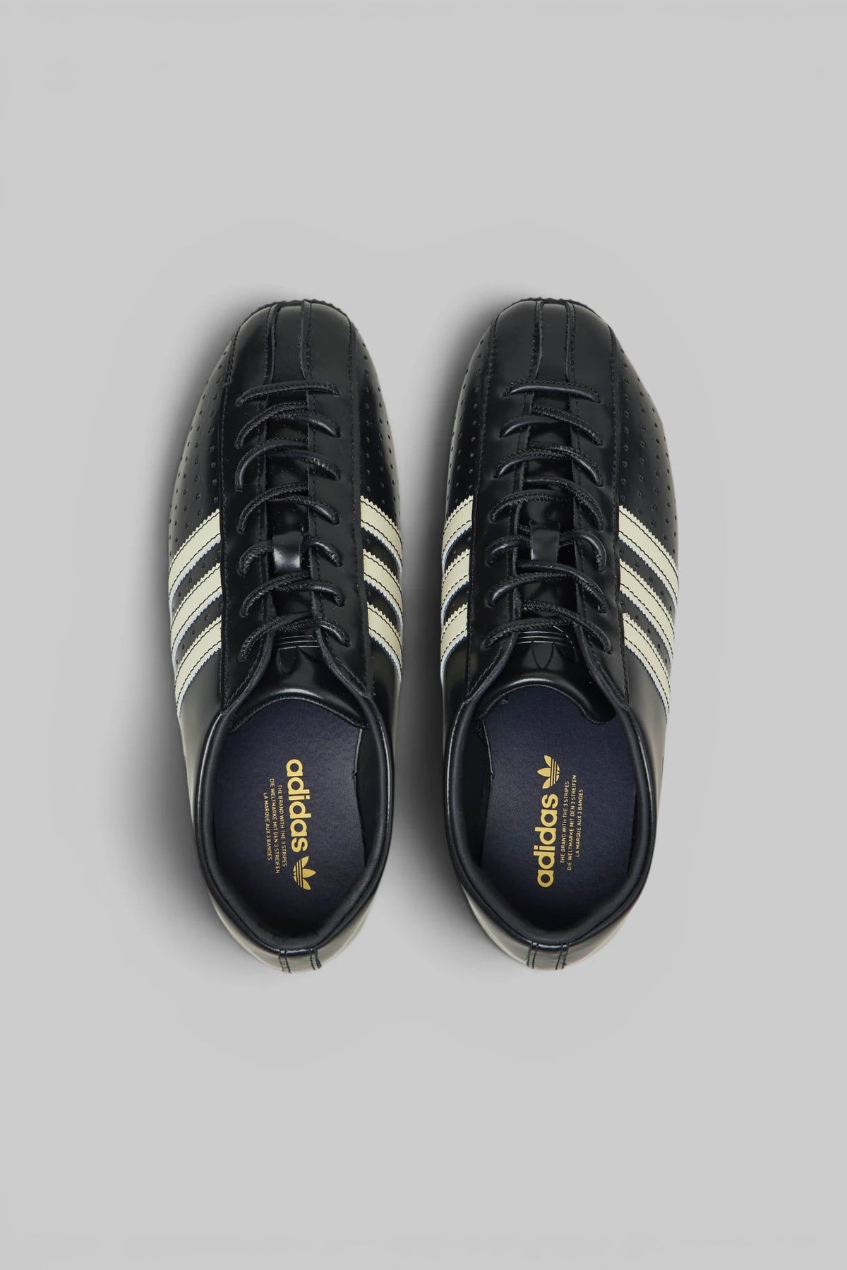 Close-up of contrast stripe detailing on Adidas Originals Japan Lux W sneaker