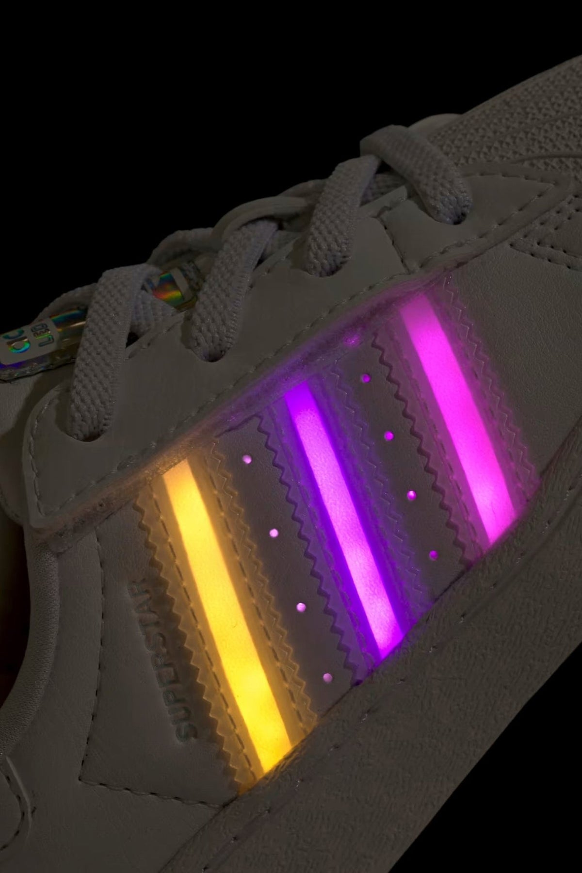 Rear view showing padded heel and Adidas branding on LED light sneakers, view 7