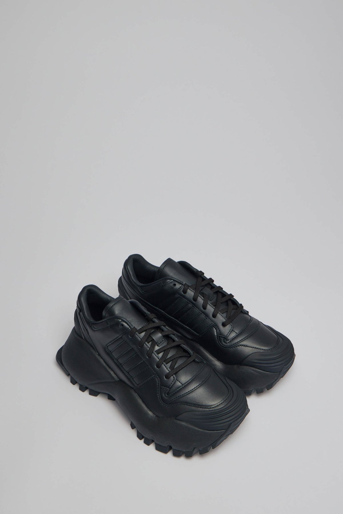 Side view of Chavarria Forum Sneaker showing distinctive design details and thick rubber sole