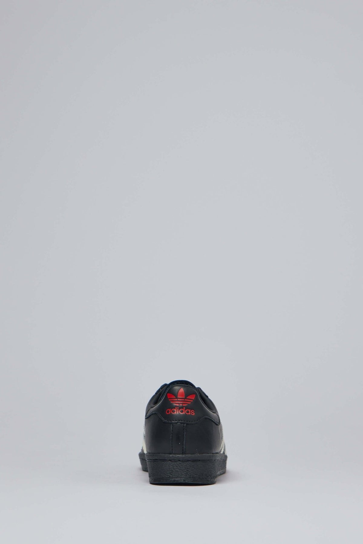 Heel detail showing red Adidas logo on Chavarria Superstar sneakers