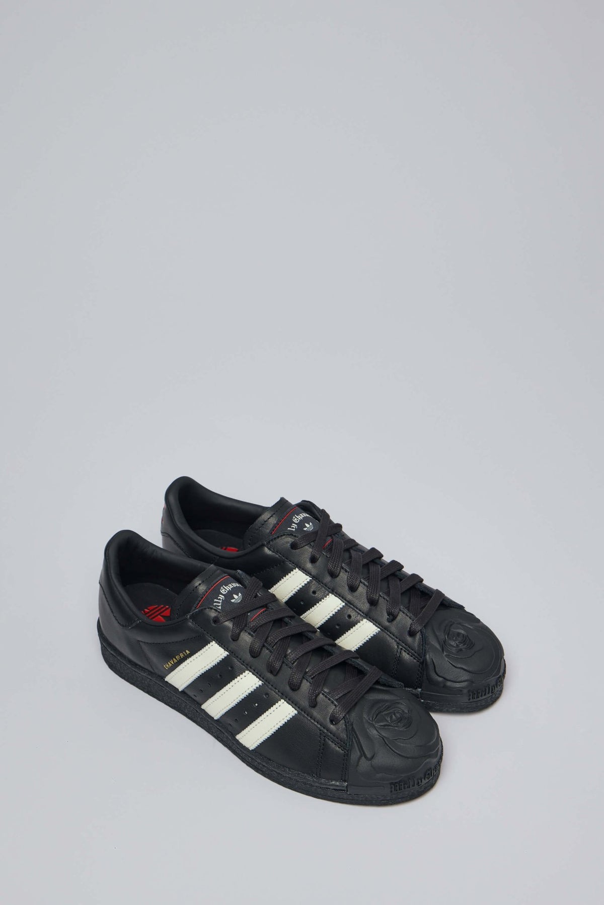 Side view of Chavarria Superstar showing white three-stripe design and perforated panels
