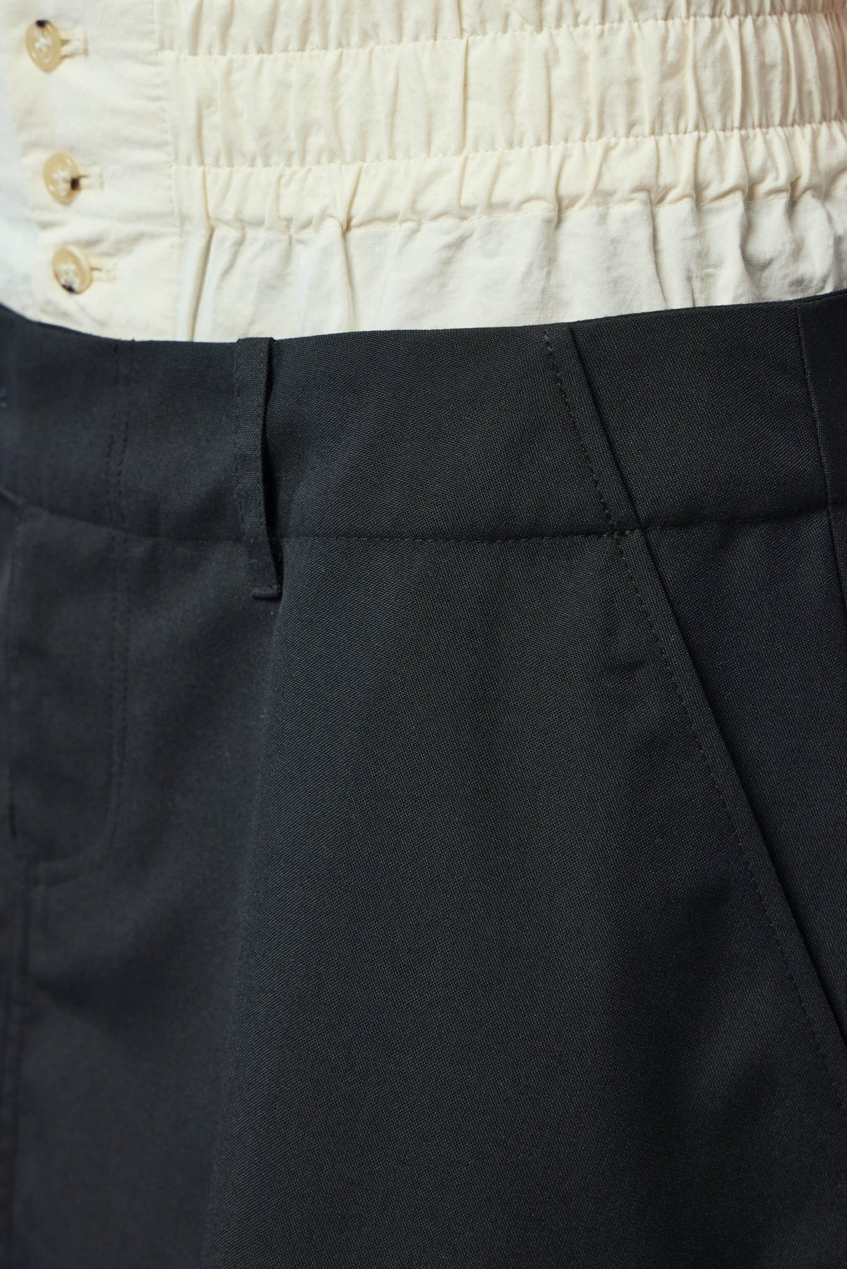 Side view of Aura Kilt showing midi length and fit