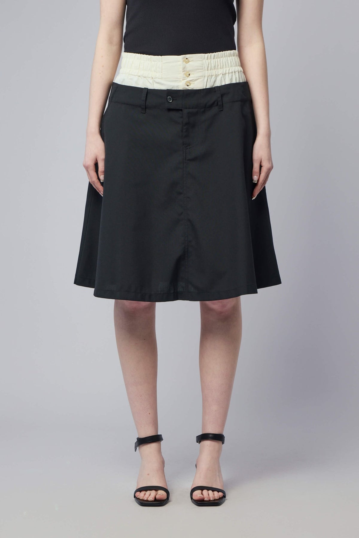 Model wearing Adnym midi kilt showcasing the relaxed silhouette