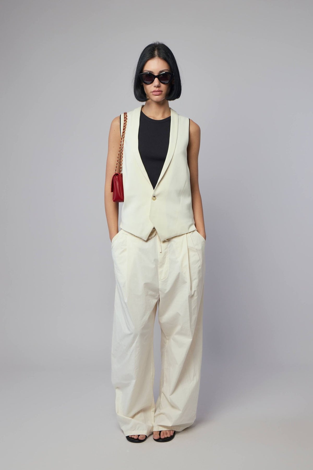 Styling shot of Adnym pants paired with casual top