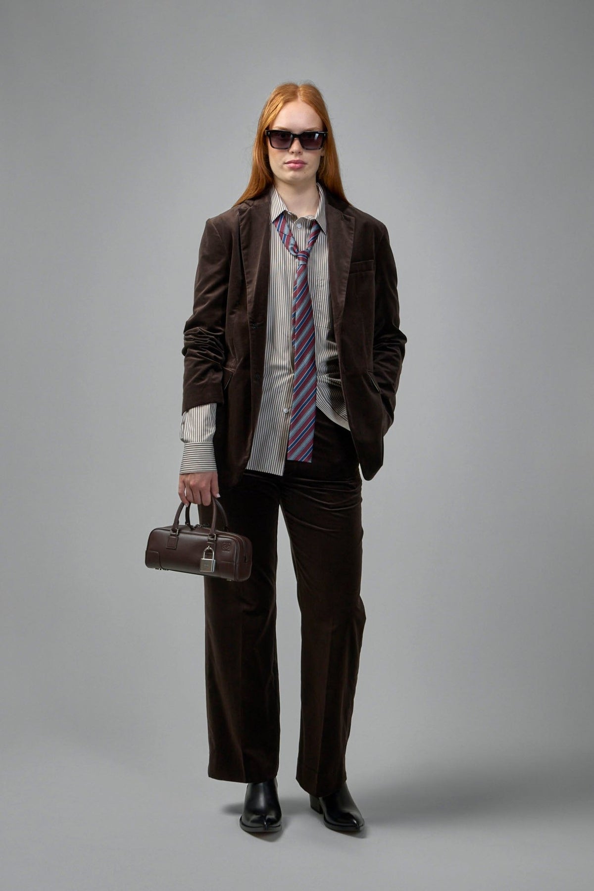 Full length view of model wearing Adnym straight pants with relaxed fit