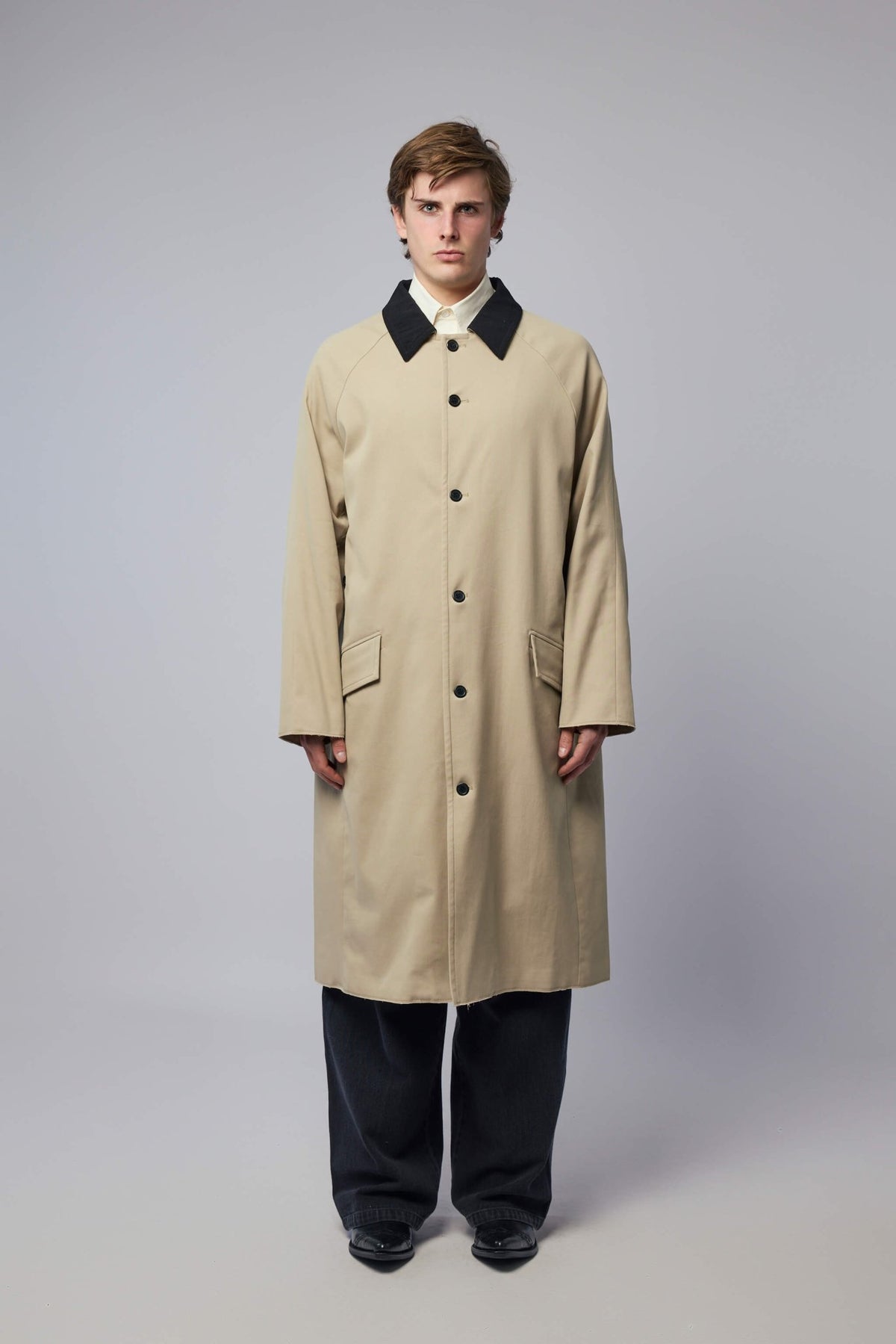 Close-up of contrasting collar detail on Adnym Rizwan coat