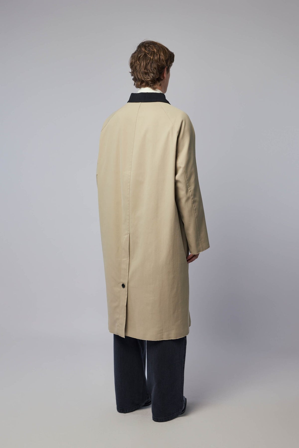 Full styling shot of Rizwan coat worn with contemporary pieces
