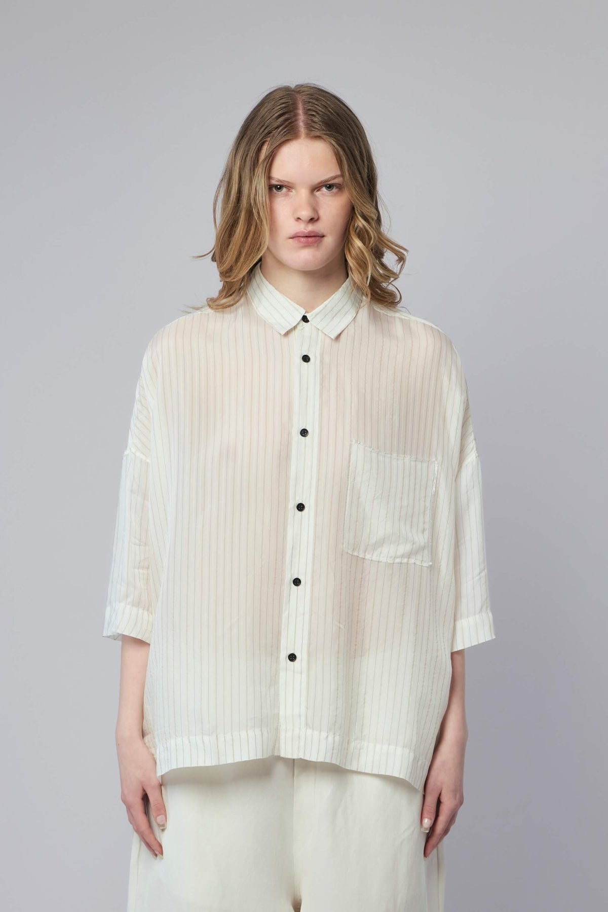 Close-up detail of premium cupro fabric texture on Adnym shirt