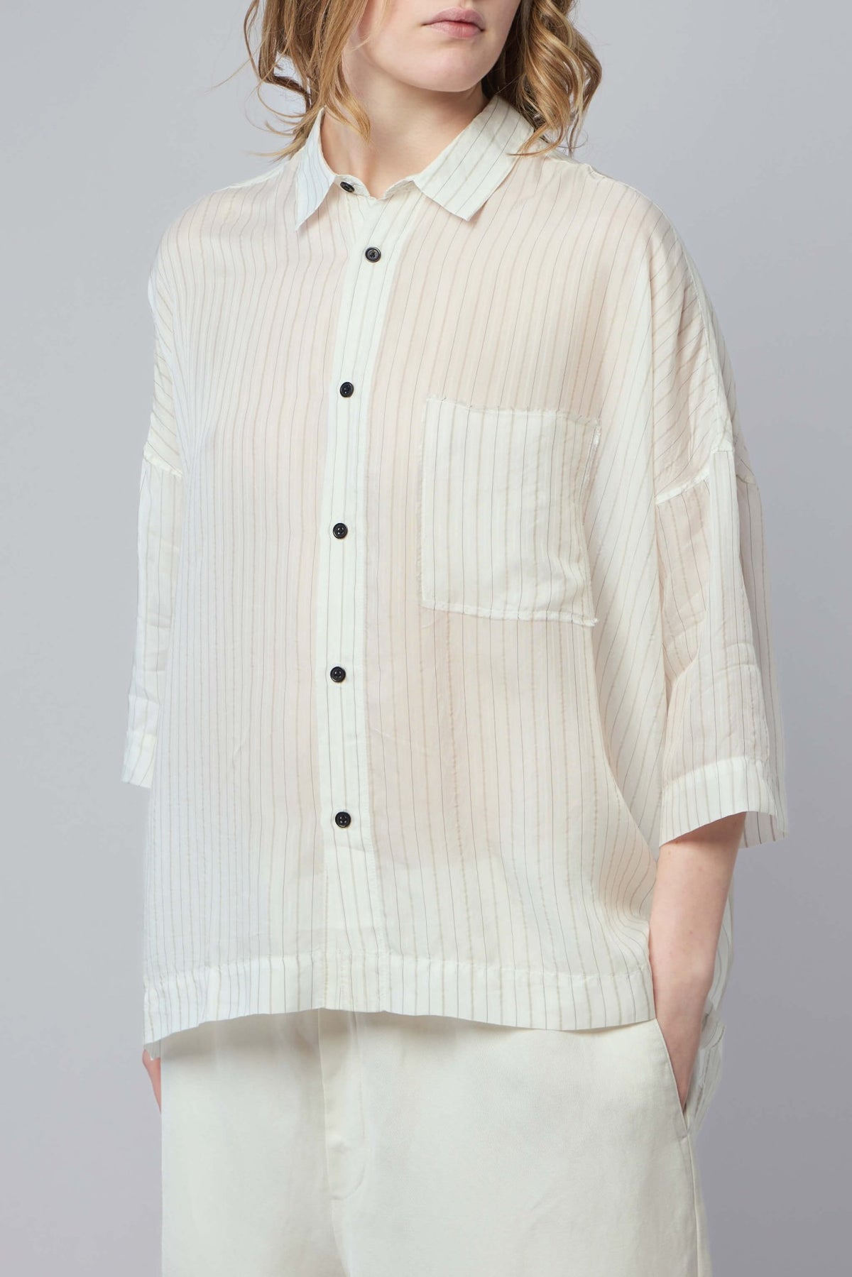 Model wearing Adnym Smog SS Shirt styled with contemporary bottoms