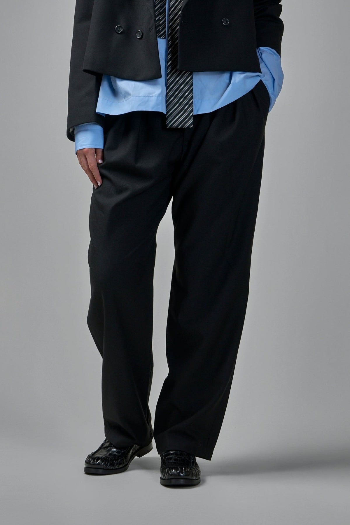 Adnym Wide-Leg Pants in black cotton suiting fabric with high waist and pleated front