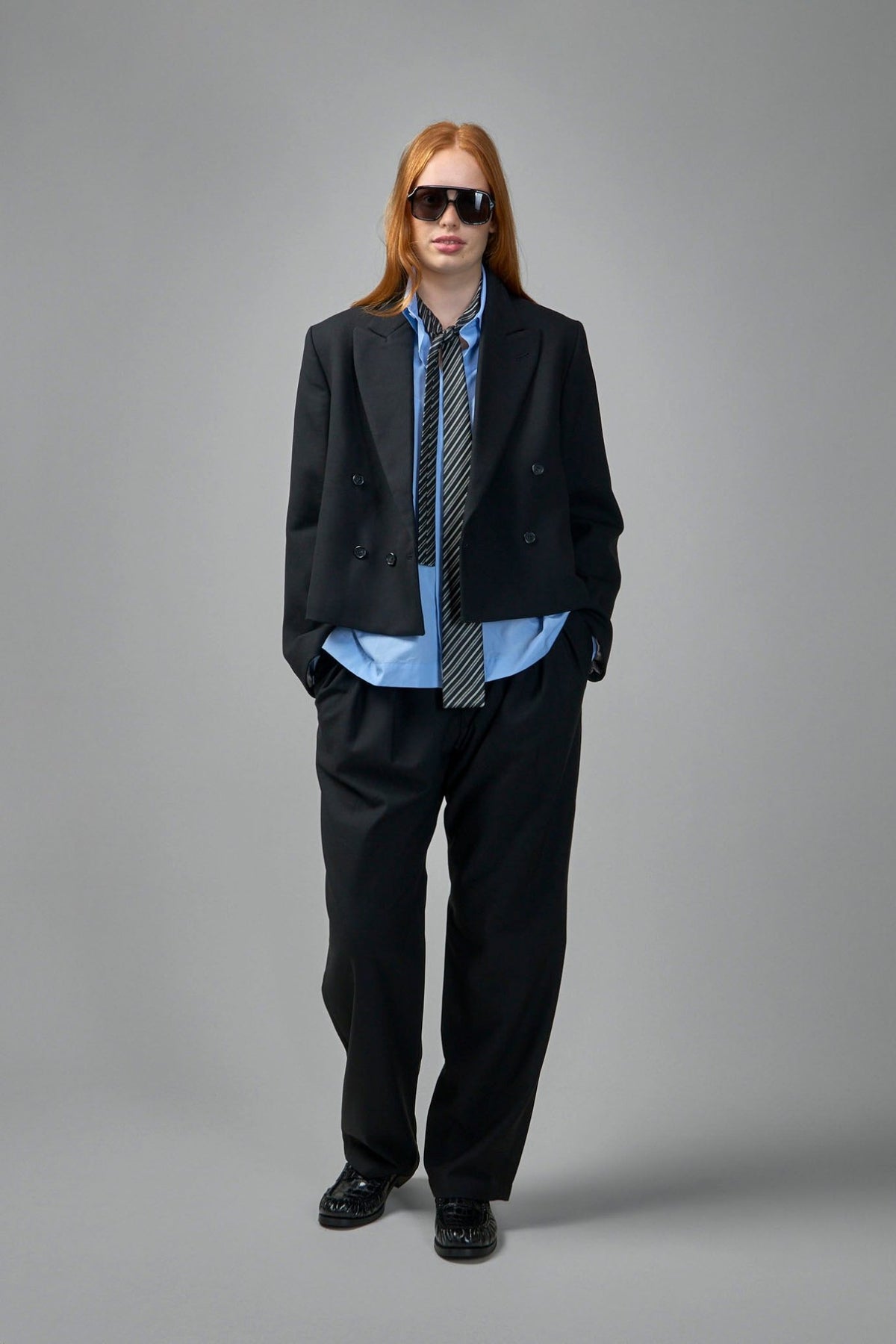 Close-up of Adnym wide-leg pants showing premium cotton suiting fabric texture