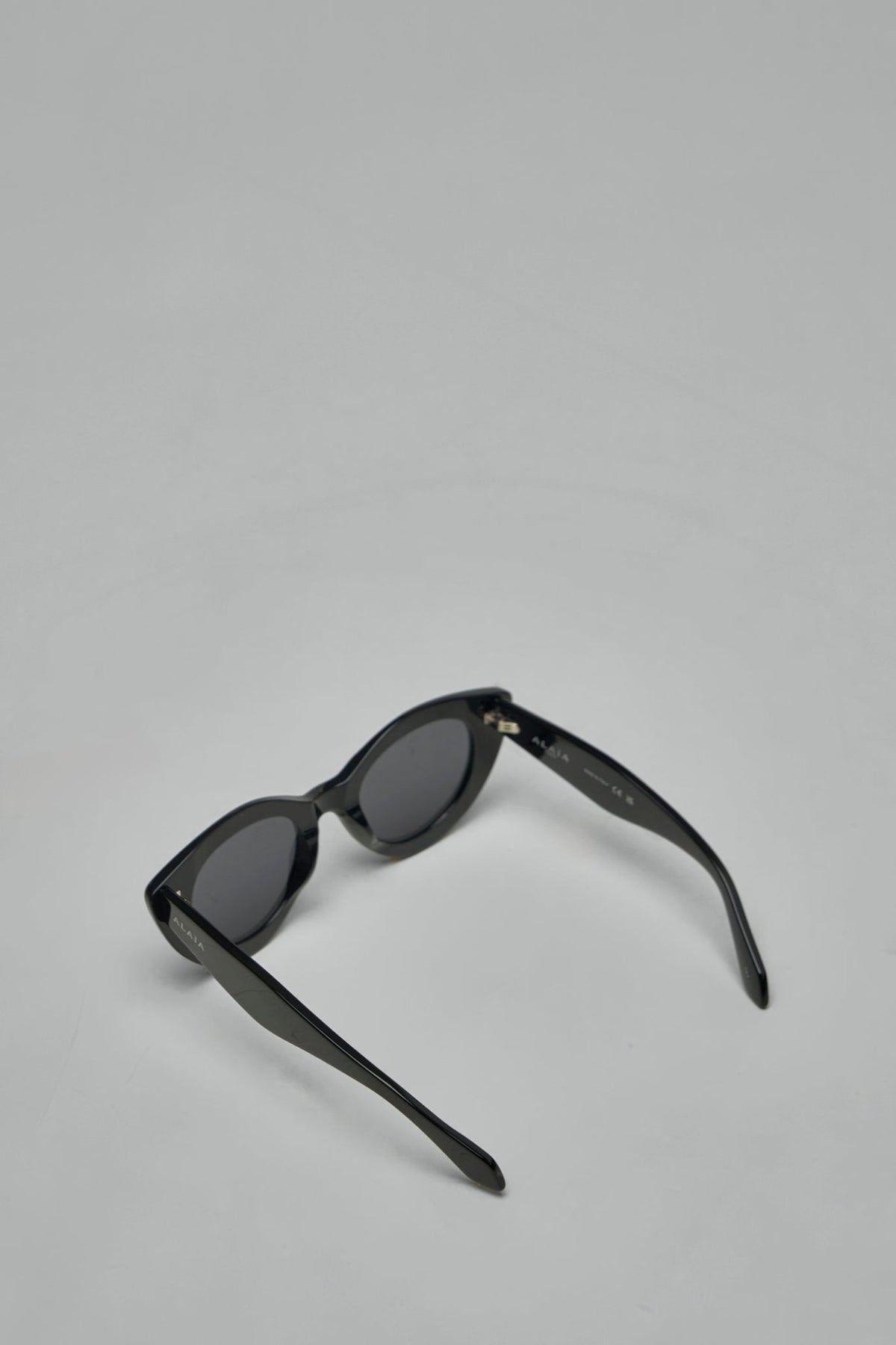 Front view of black acetate sunglasses with dark grey lenses