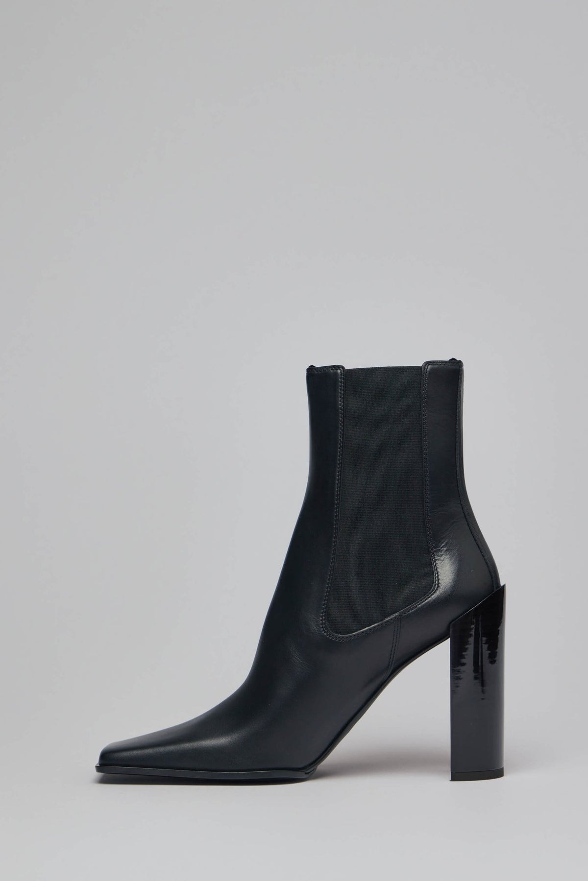 Side profile of black leather Alaïa boots with slip-on construction