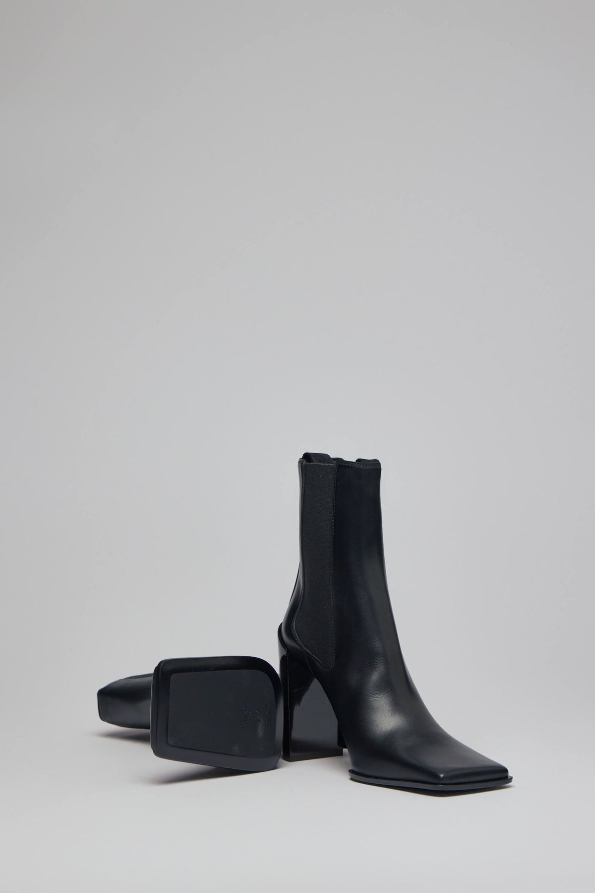 Full view of Alaïa block heel boots on model