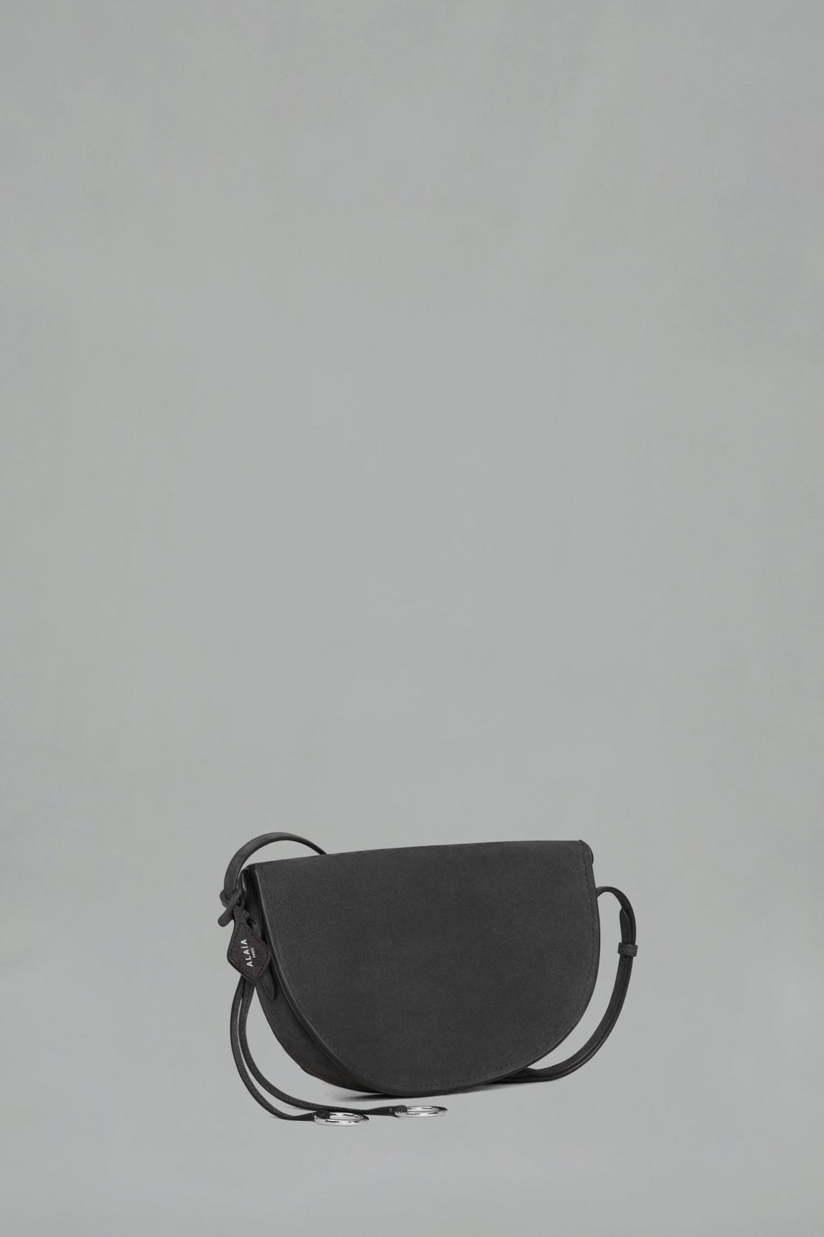Luxury nubuck leather crossbody bag with foldover flap closure
