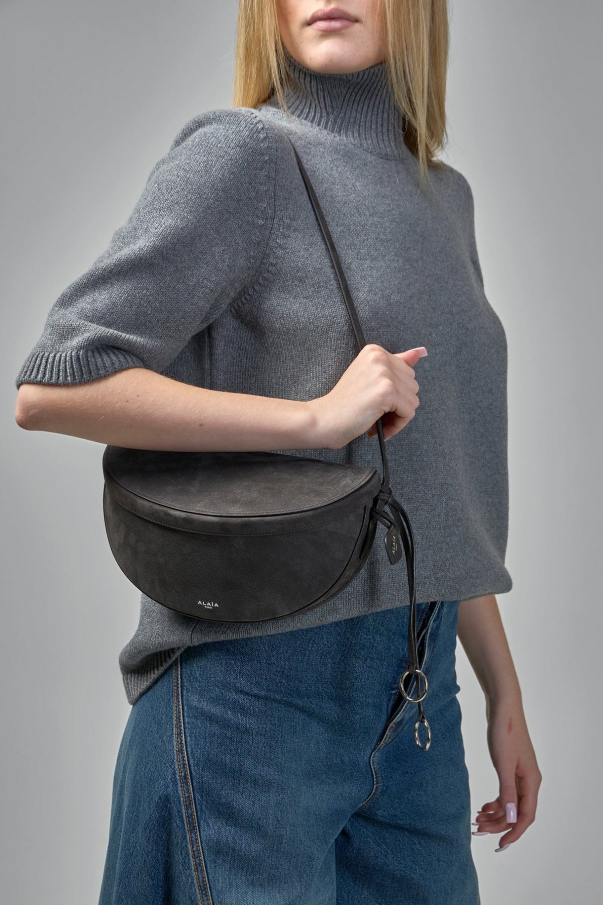 Alaïa signature hardware details on premium calfskin crossbody bag