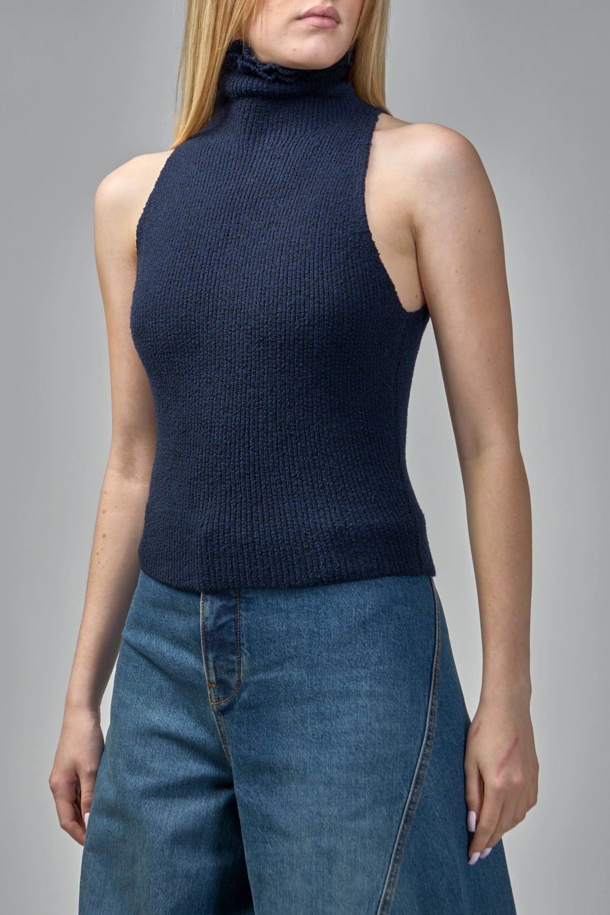 Side view showing ribbed texture and hip-length fit