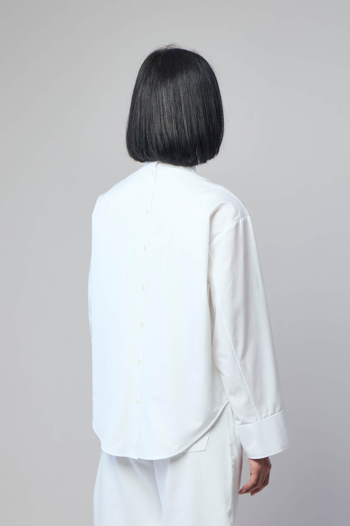 Detail shot of mandarin collar on Alaïa poplin shirt