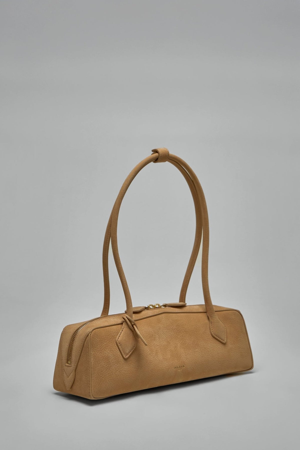 Close-up of pebbled goatskin leather texture on Alaïa shoulder bag