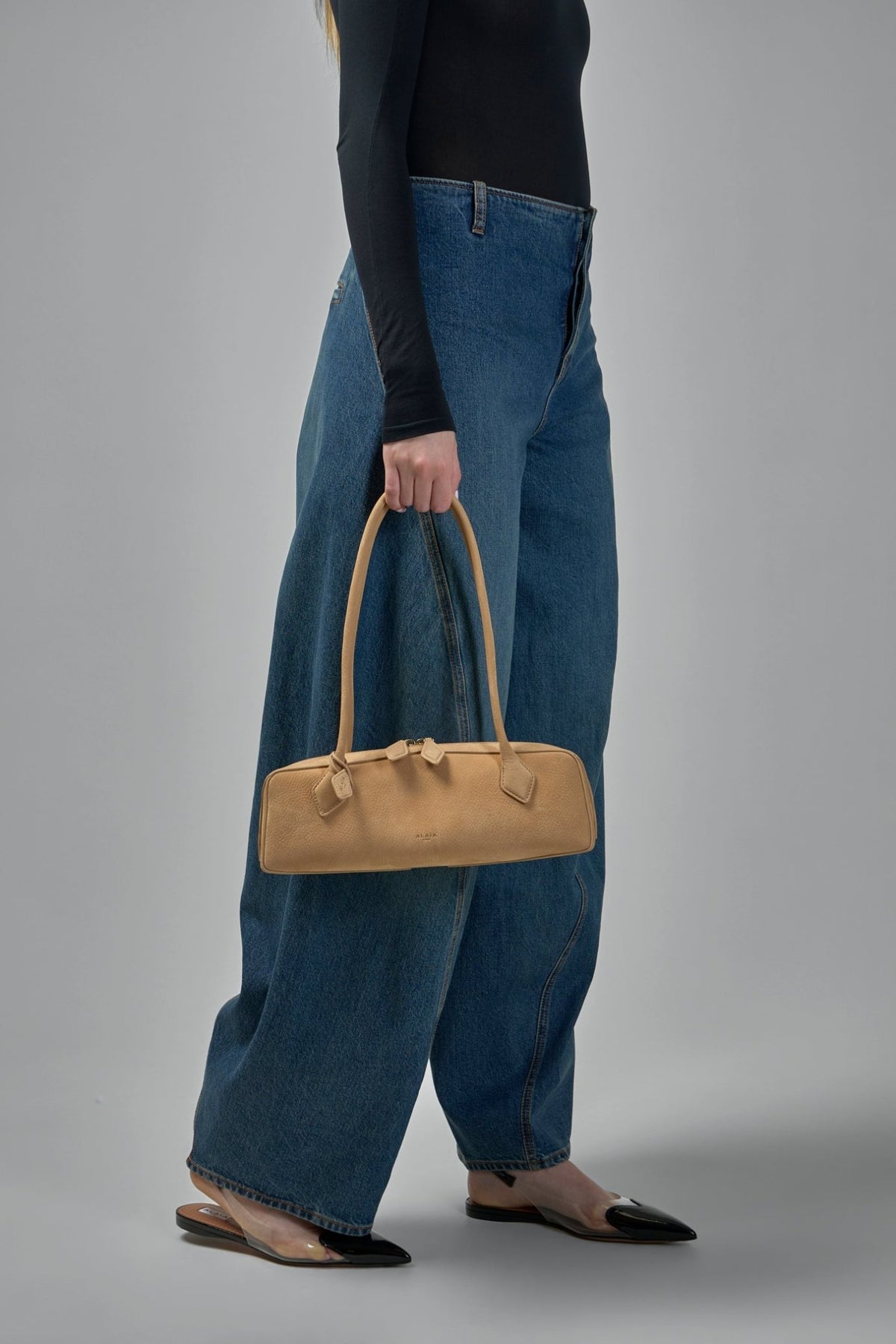 Interior view of Le Teckel bag showing zip closure and leather lining