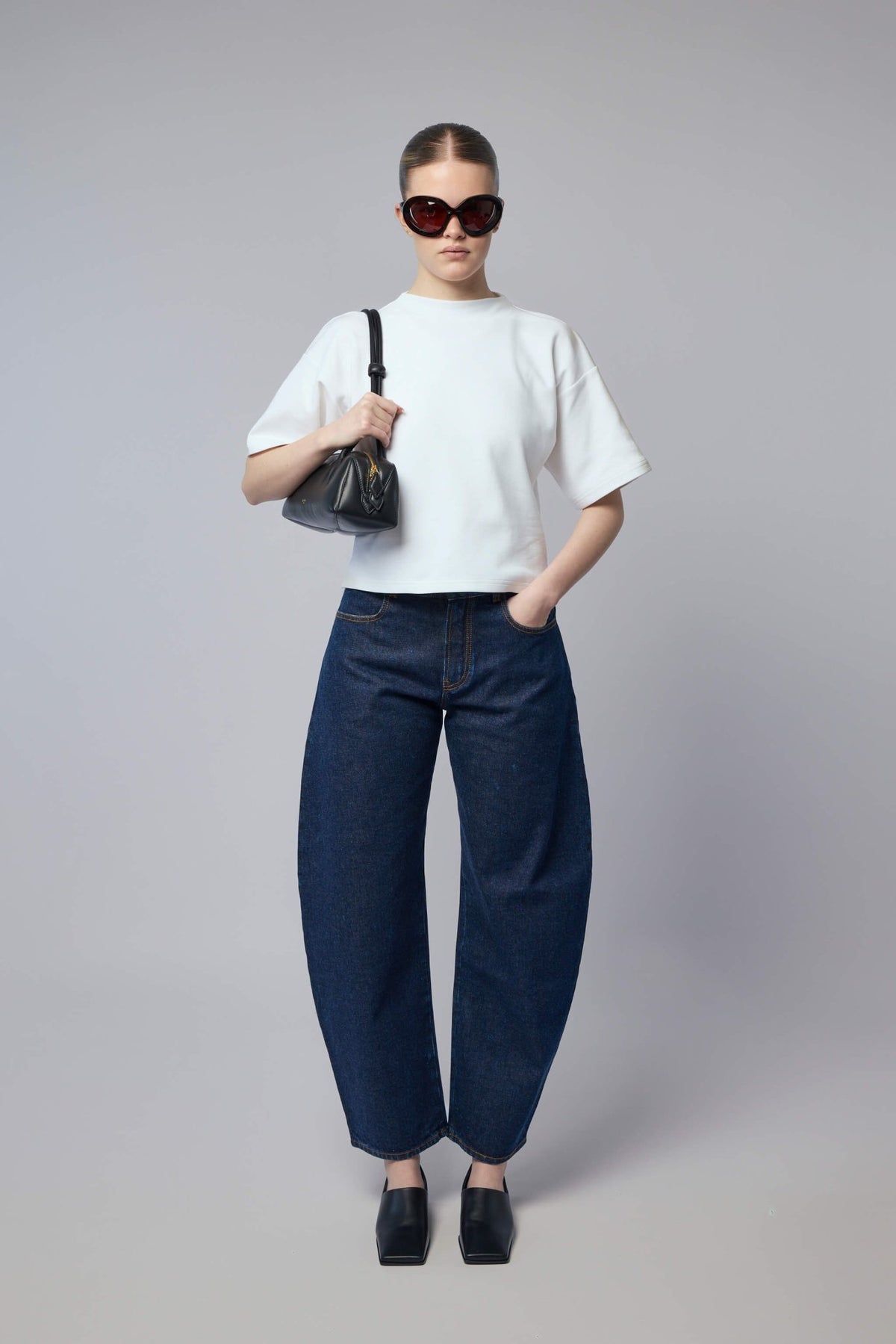 Full outfit styling with Alaïa wide-leg pants for contemporary look