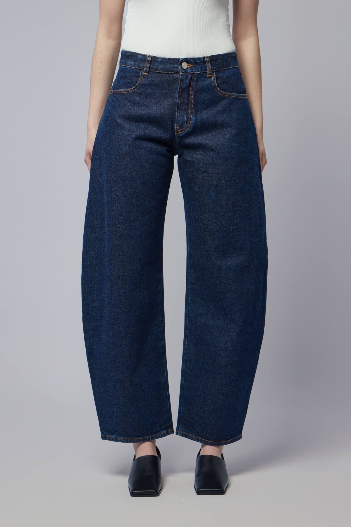 Model wearing Alaïa Low Round Pants showing relaxed wide-leg silhouette